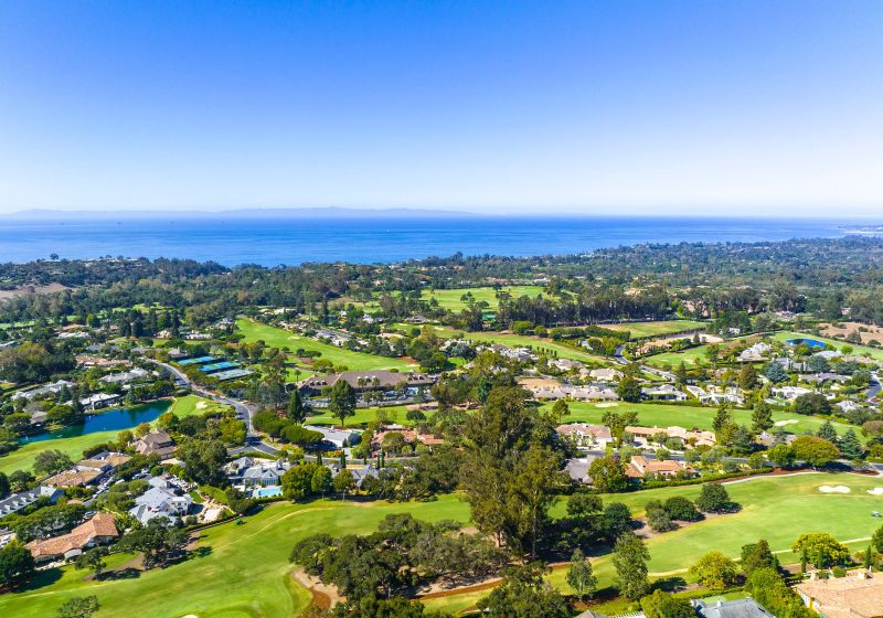 Aerial view over Montecito's Birnam Wood enclave to a panoram of the Pacific Ocean.