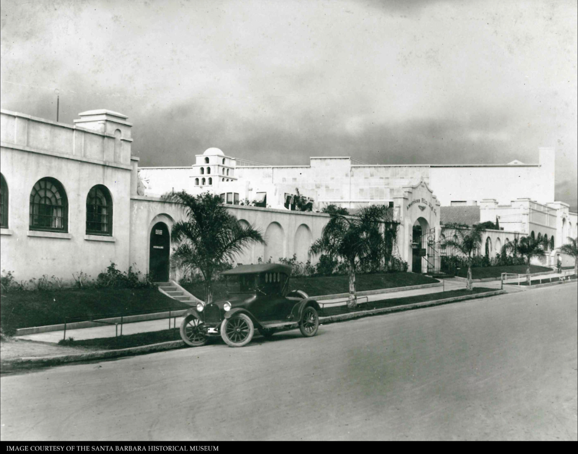 Model T car in front of Santa Barbara's Flying A Studios in a black and white vintage photograph.