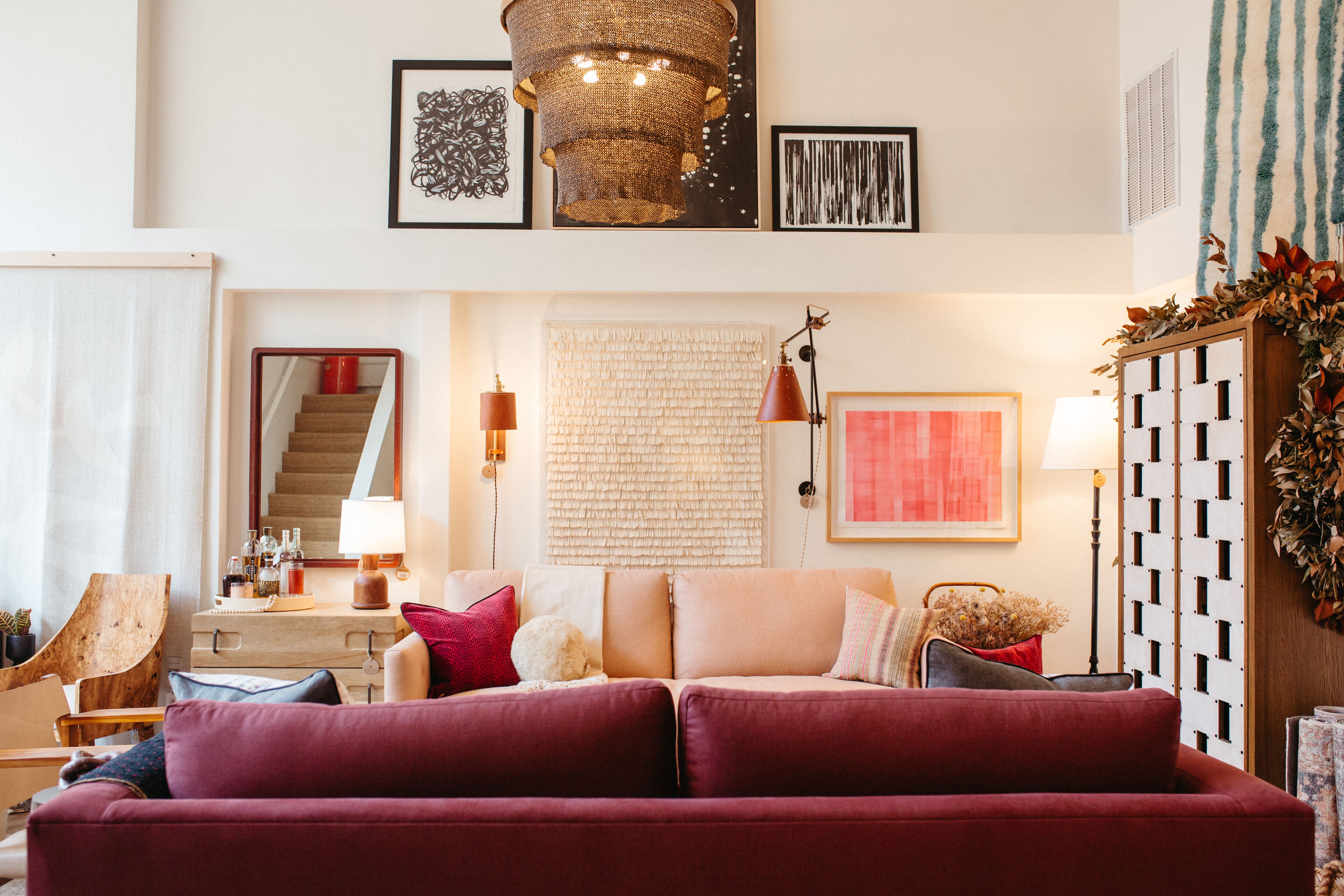 Inside an interior design store, showing a purple sofa and other upscale furnishings