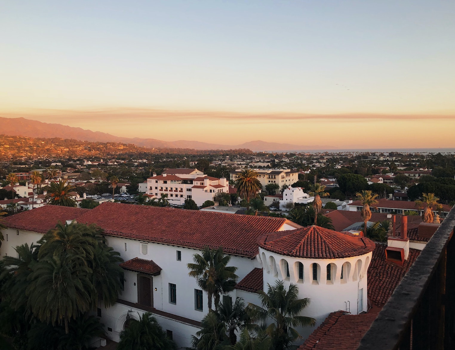 Birds eye view of santa barbara with the red tiled roofs of downtown out to the ocean