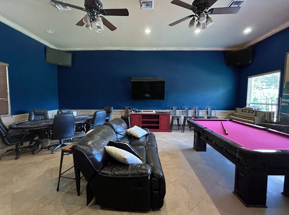 Transitional Game Room: Navy Elegance and Modern Comfort