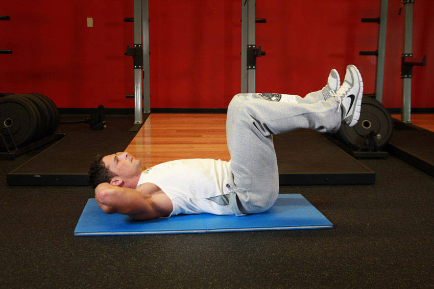 Air Bike — starting position, working the abs