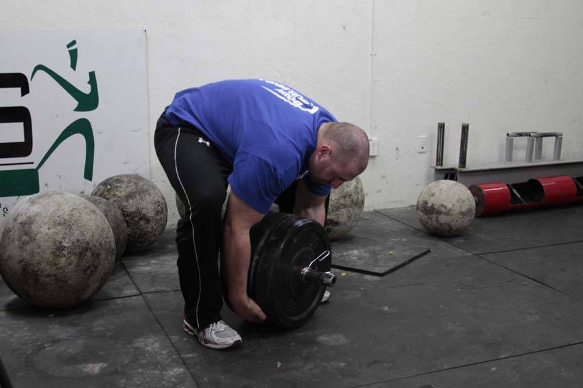 Atlas Stone Trainer — starting position, working the lower back
