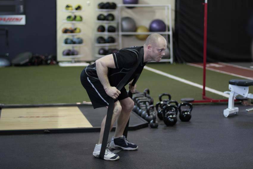 Band Good Morning — starting position, working the hamstrings