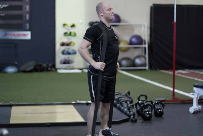 Band Good Morning — end position, working the hamstrings