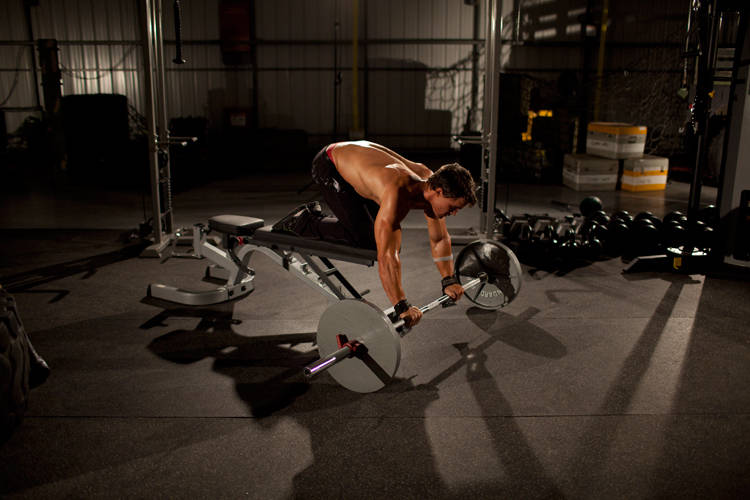 Barbell Rollout from Bench — starting position, working the abs