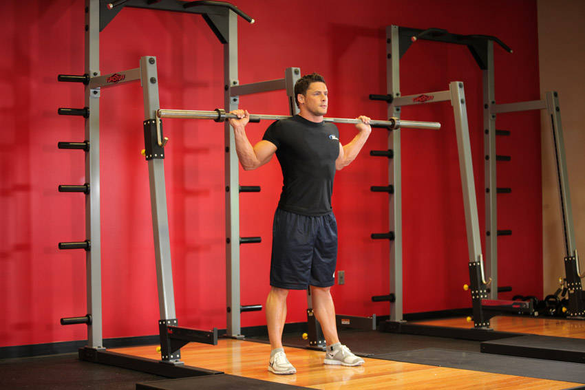 Barbell Side Bend — starting position, working the abs