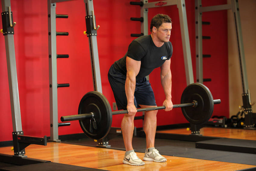 Bent Over Barbell Row — starting position, working the middle back