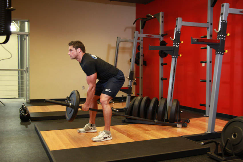 Bent Over One-Arm Long Bar Row — starting position, working the middle back
