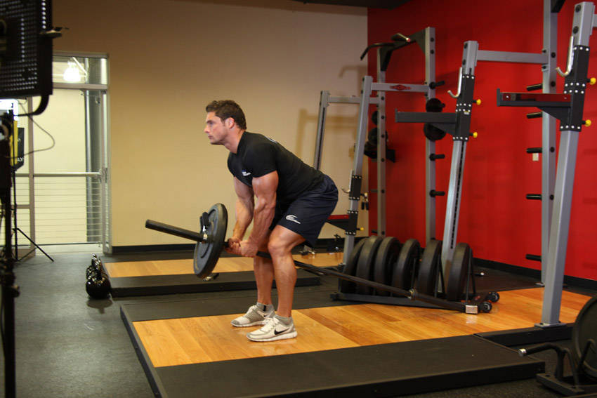 Bent Over Two-Arm Long Bar Row — starting position, working the middle back