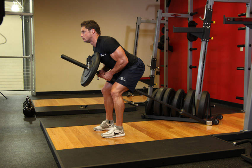Bent Over Two-Arm Long Bar Row — end position, working the middle back