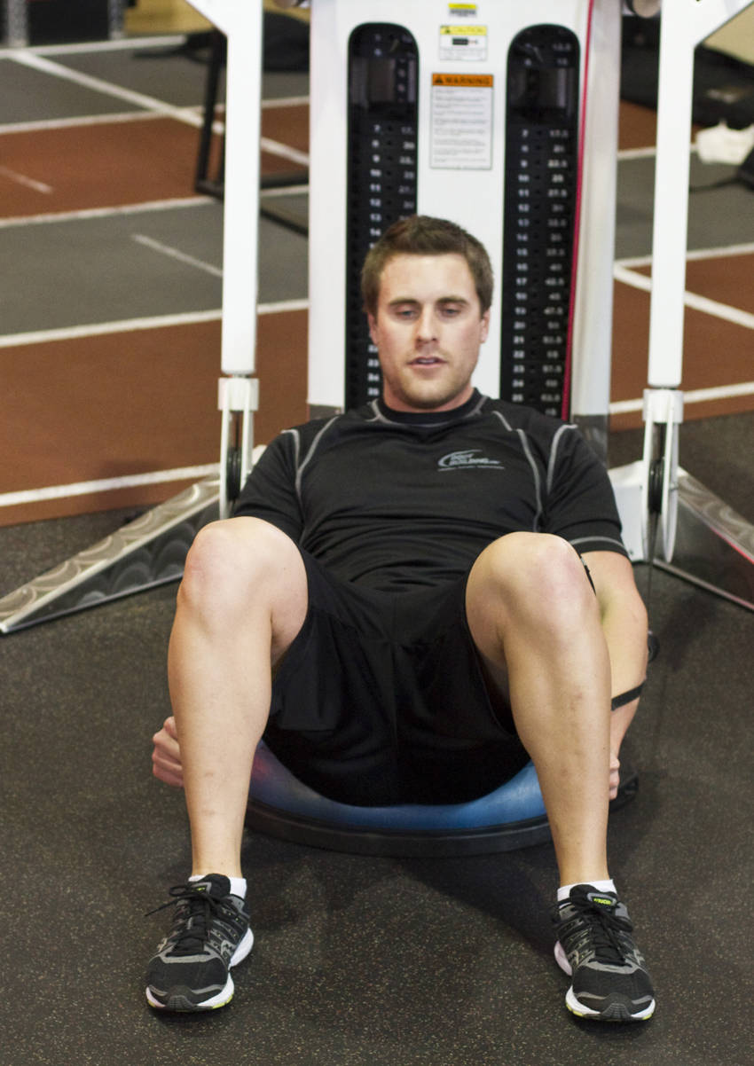 Bosu Ball Cable Crunch With Side Bends — starting position, working the abs