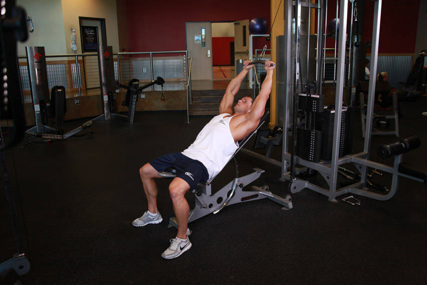 Cable Incline Pushdown — starting position, working the lats