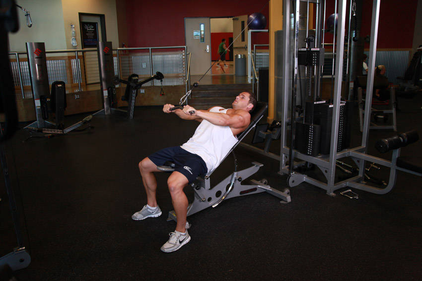 Cable Incline Pushdown — end position, working the lats