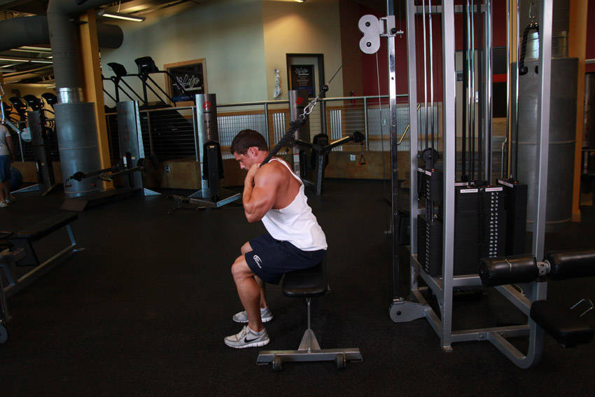 Cable Seated Crunch — starting position, working the abs