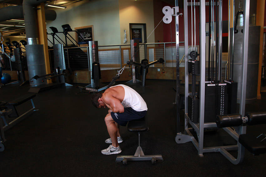 Cable Seated Crunch — end position, working the abs