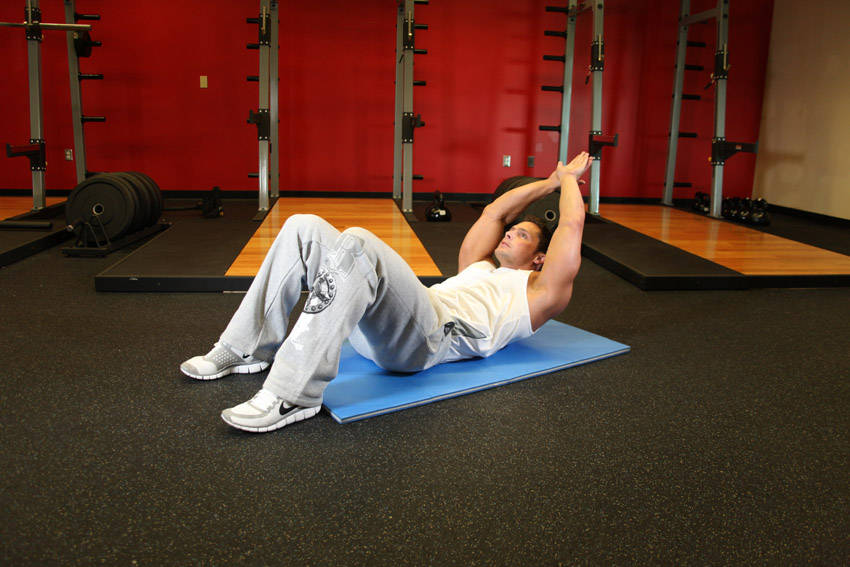 Crunch - Hands Overhead — end position, working the abs