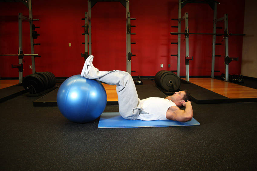 Crunch - Legs On Exercise Ball — starting position, working the abs