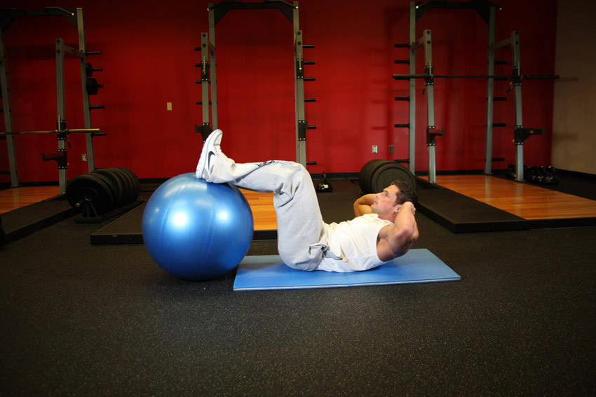 Crunch - Legs On Exercise Ball — end position, working the abs