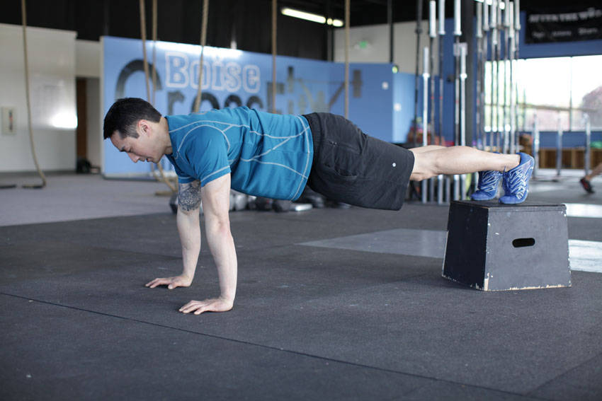 Decline Push-Up — starting position, working the chest