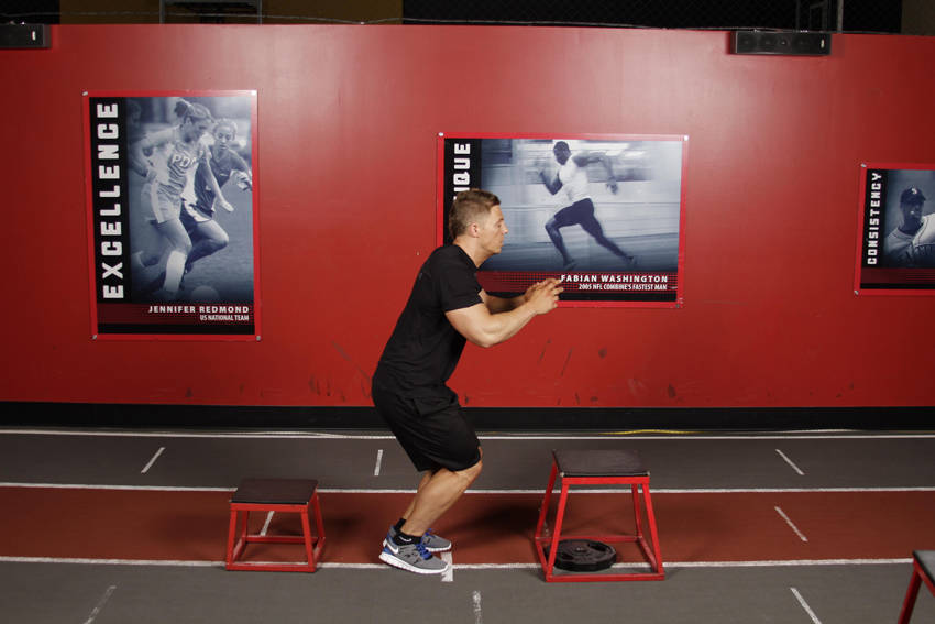Depth Jump Leap — end position, working the quads