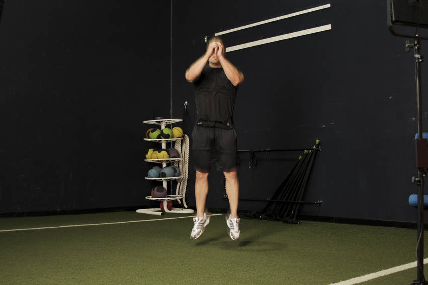 Double Leg Butt Kick — end position, working the quads