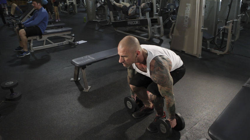 Dumbbell Clean — starting position, working the hamstrings