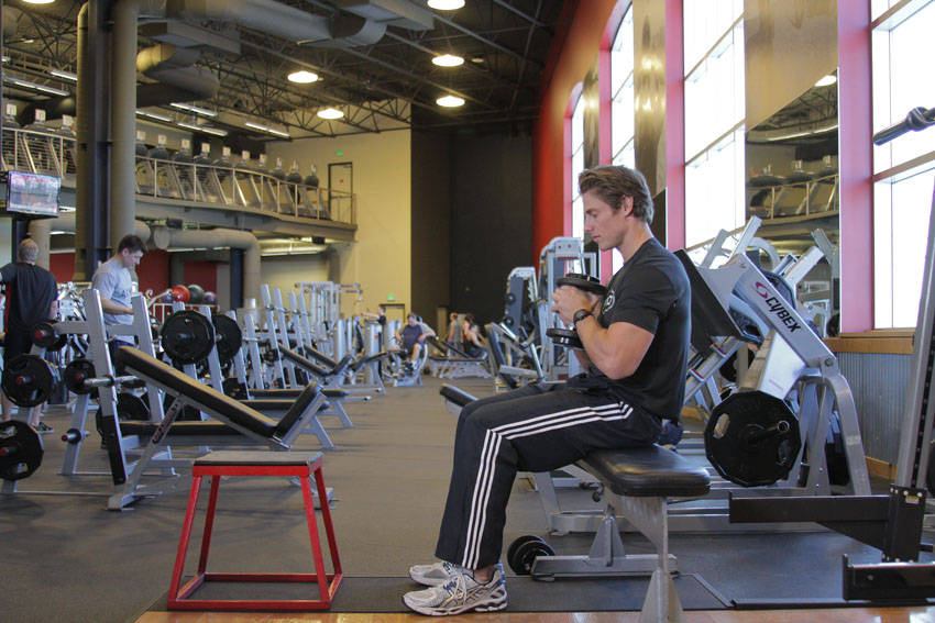 Dumbbell Seated Box Jump — starting position, working the quads