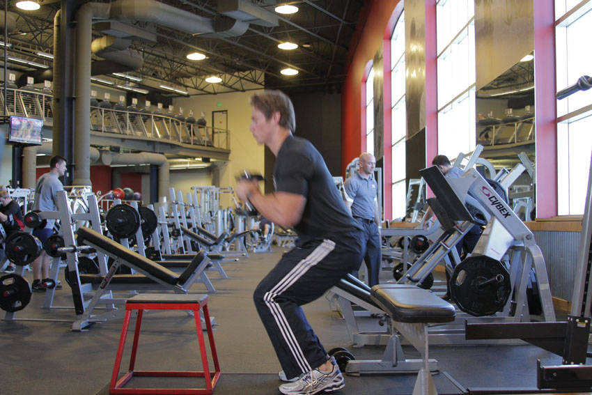 Dumbbell Seated Box Jump — end position, working the quads
