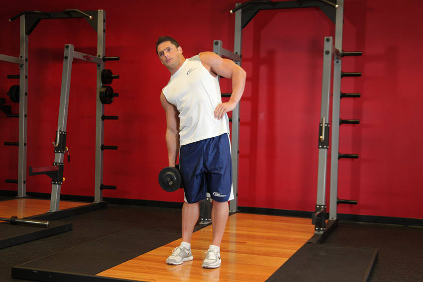 Dumbbell Side Bend — starting position, working the abs