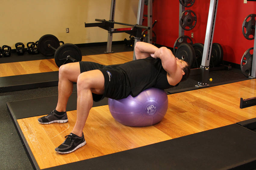 Exercise Ball Crunch — starting position, working the abs