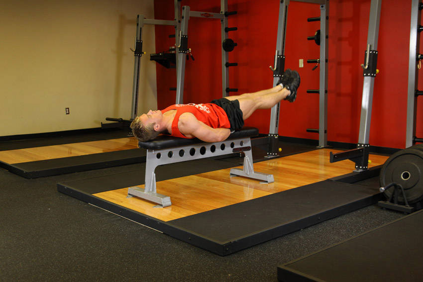 Flat Bench Leg Pull-In — end position, working the abs