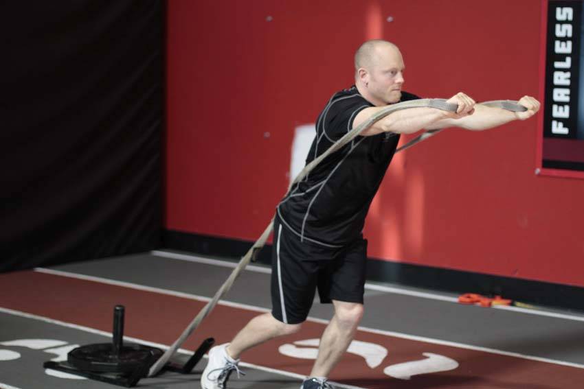 Forward Drag with Press — end position, working the chest