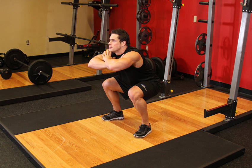 Freehand Jump Squat — starting position, working the quads
