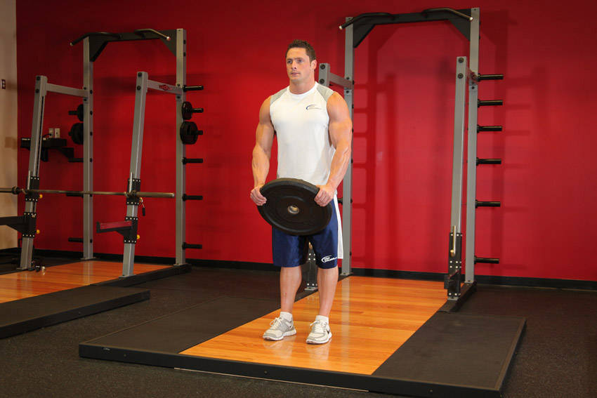 Front Plate Raise — starting position, working the shoulders