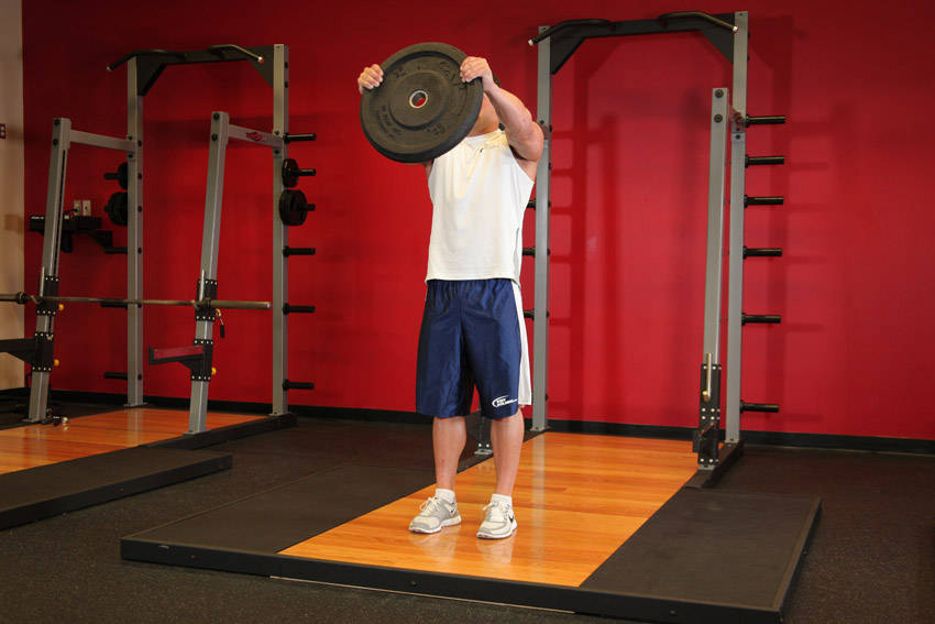 Front Plate Raise — end position, working the shoulders