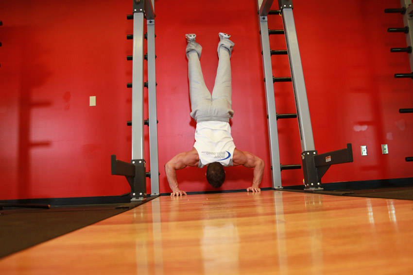 Handstand Push-Ups — end position, working the shoulders