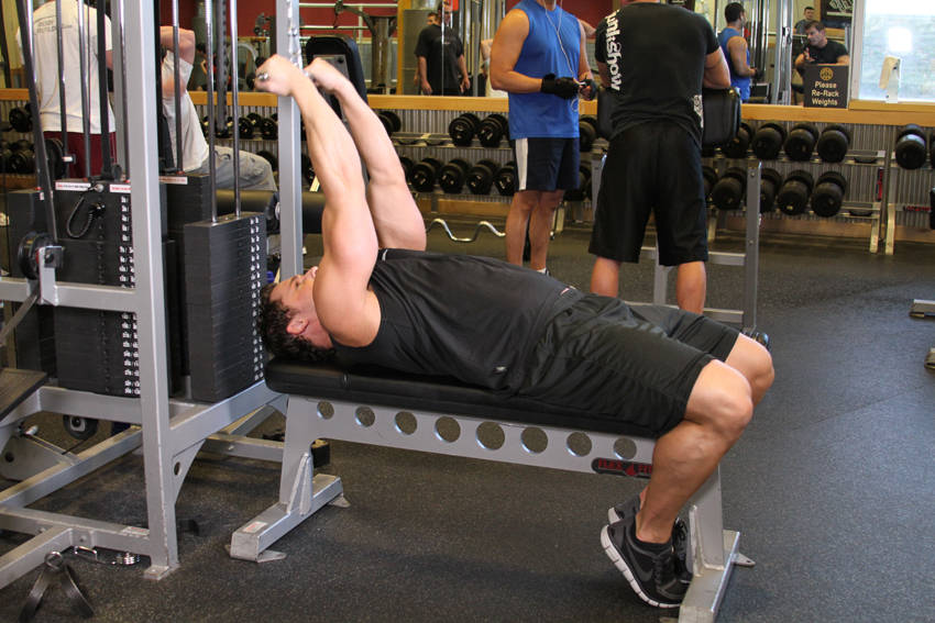High Cable Curls — starting position, working the biceps