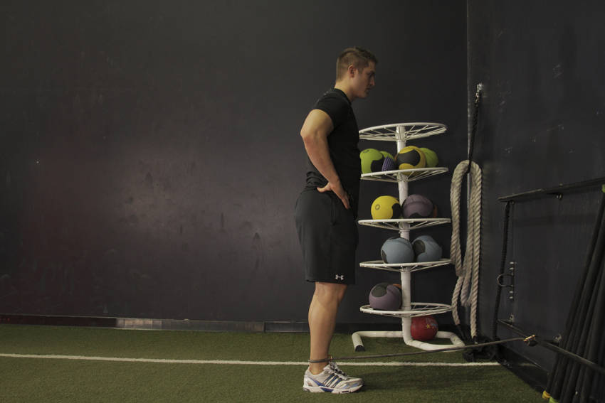 Hip Extension with Bands — starting position, working the glutes