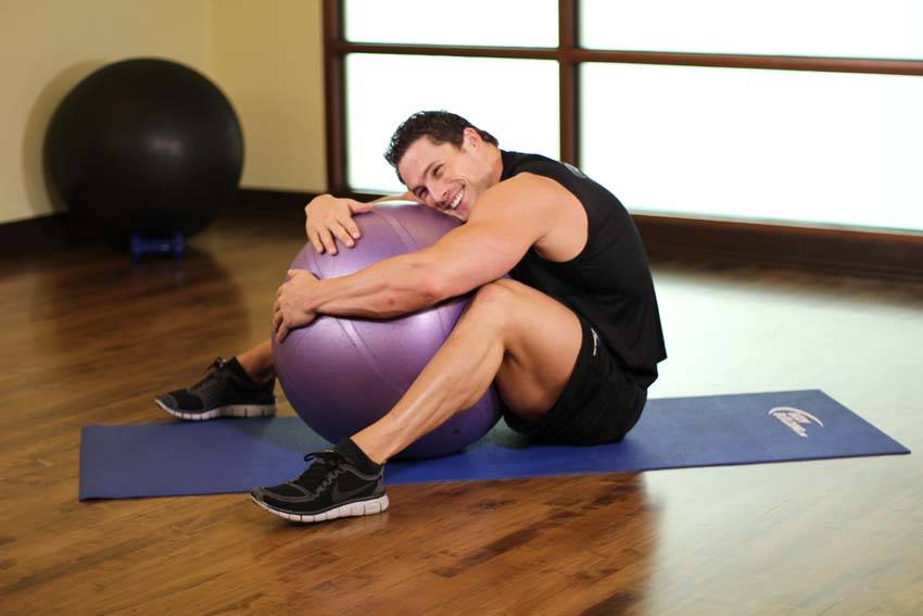 Hug A Ball — end position, working the lower back