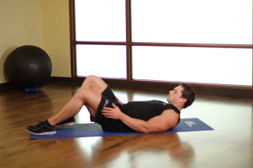 Hug Knees To Chest — starting position, working the lower back