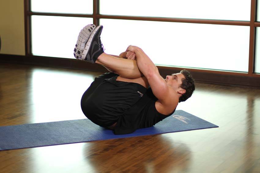 Hug Knees To Chest — end position, working the lower back