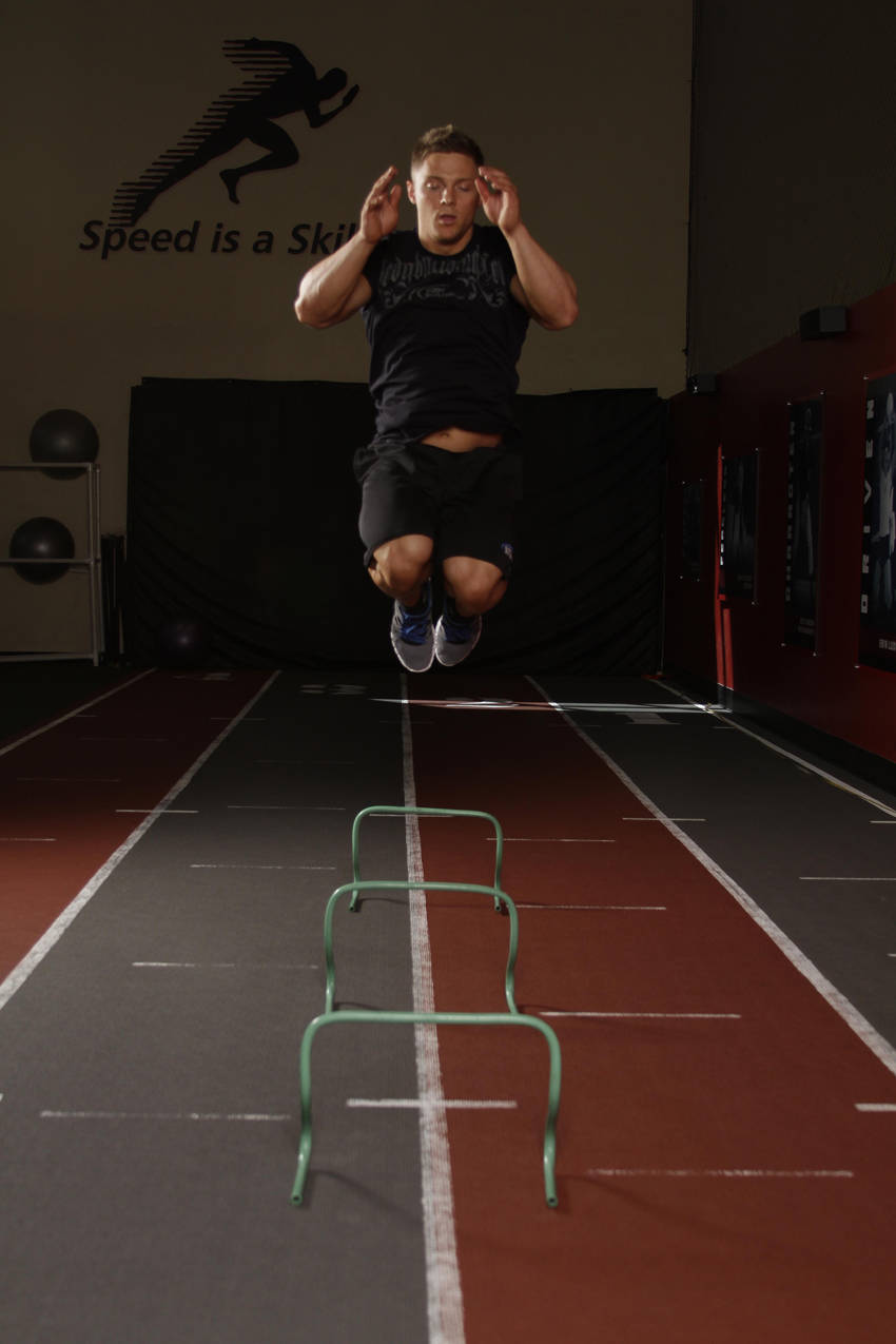 Hurdle Hops — end position, working the hamstrings