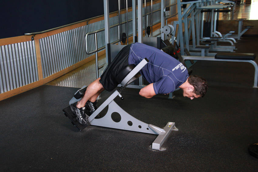 Hyperextensions (Back Extensions) — end position, working the lower back