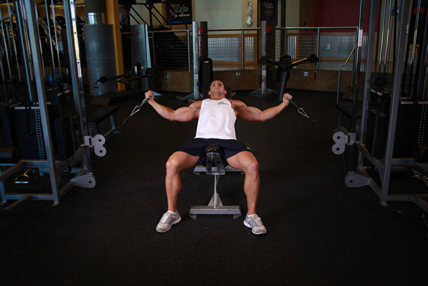 Incline Cable Flye — starting position, working the chest
