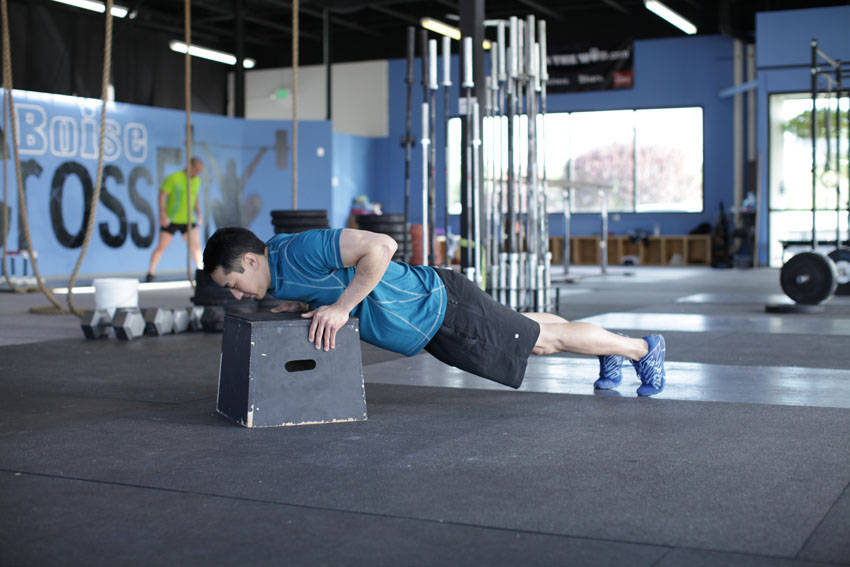 Incline Push-Up — starting position, working the chest