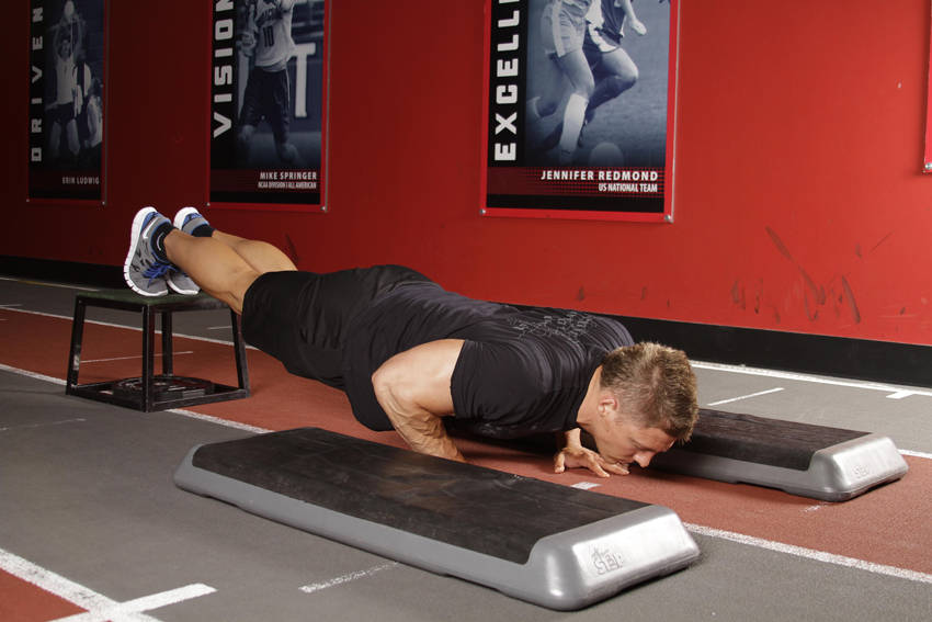 Incline Push-Up Depth Jump — starting position, working the chest