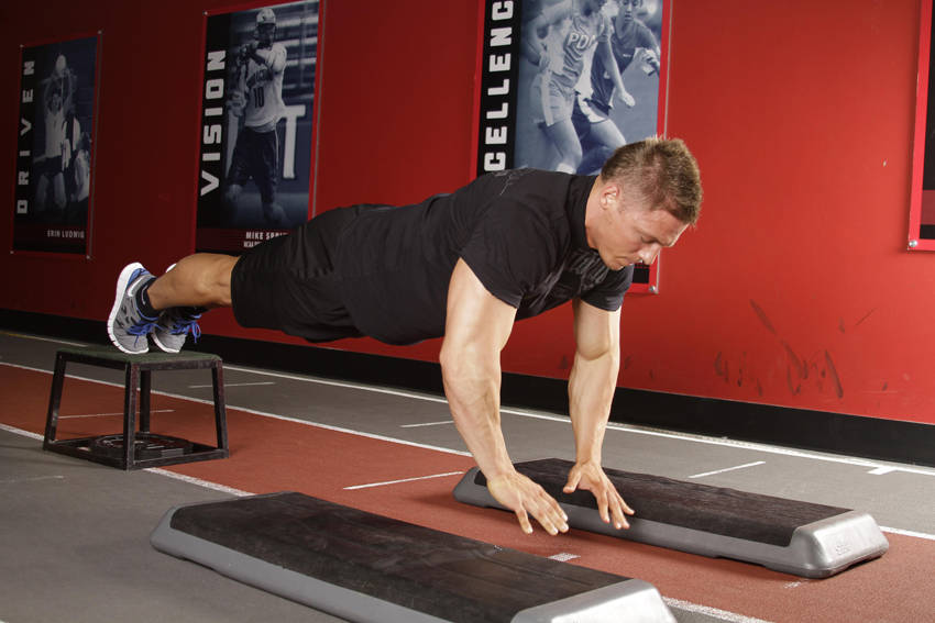 Incline Push-Up Depth Jump — end position, working the chest