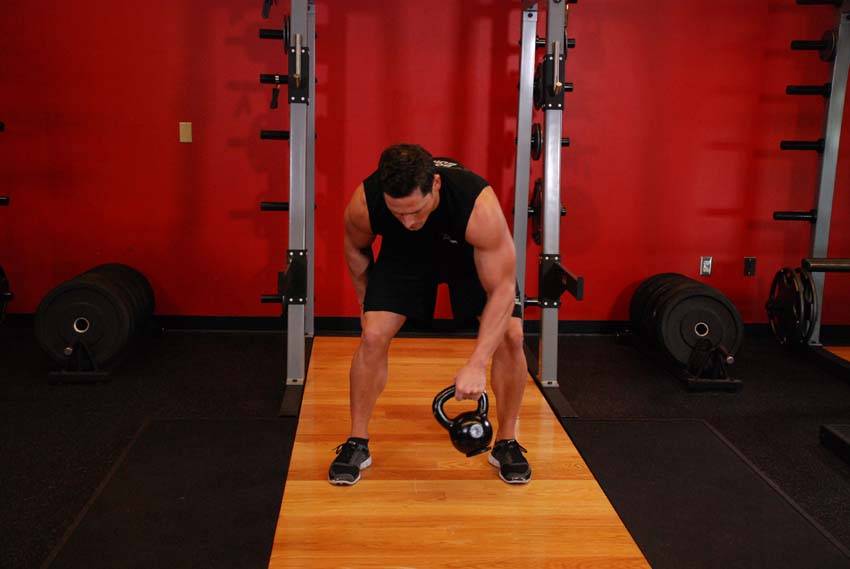 Kettlebell Figure 8 — end position, working the abs