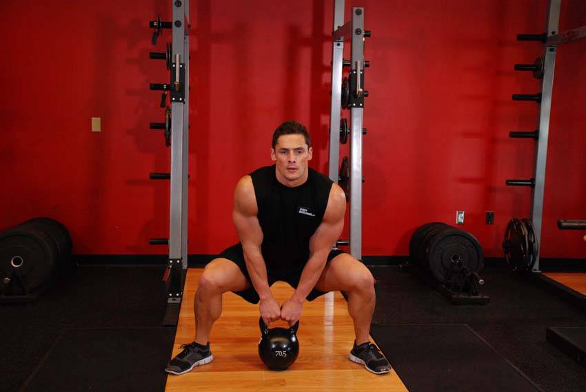 Kettlebell Sumo High Pull — starting position, working the traps